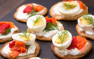 Russian buckwheat pancakes blini with cream and caviar