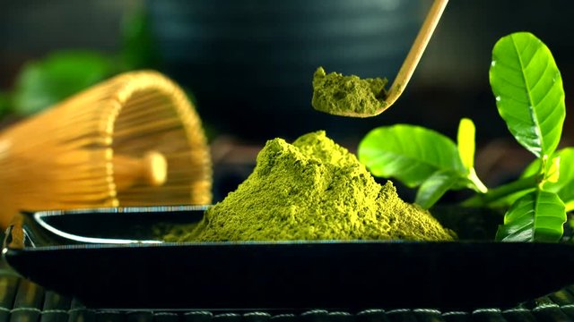 Matcha powder. Organic green matcha tea. Dolly shot. UHD video footage. Ultra high definition 3840X2160