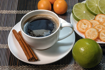 A cup of coffee with slice lime