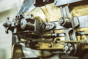 A piece of old brass and steel machinery