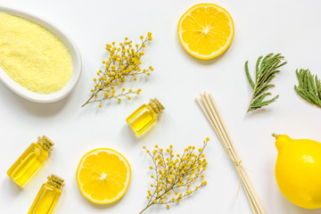 Natural sea salt and organic oil on white background top view