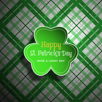 Vector Happy St. Patrick's Day poster on the white and green line pattern background, leaf of clover shape cut from paper, shadow, text.