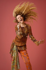 Fototapeta premium Rock star singing into a microphone