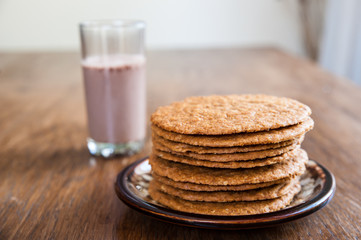 Smoothie and biscuits on a wooden table