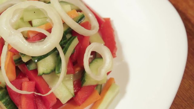 Healthy salad with fresh vegetables. Dietetic foods from environmentally friendly organic products. Vegetables from his garden. Slow rotate (1080p 25 fps; canon 7d, Sigma 24-70)