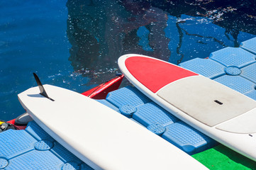a pair of single stand up paddle in a row 01