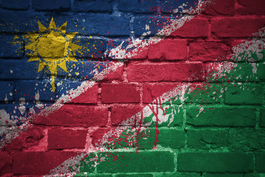 painted national flag of namibia on a brick wall