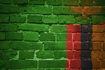 painted national flag of zambia on a brick wall