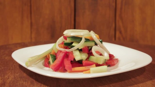 Healthy salad with fresh vegetables. Dietetic foods from environmentally friendly organic products. Vegetables from his garden. Slow rotate (1080p 25 fps; canon 7d, Sigma 24-70)