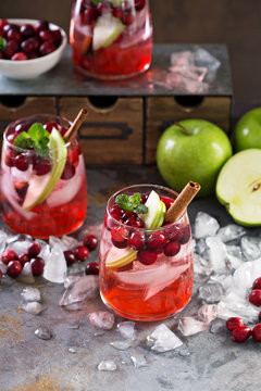 Winter refreshing drink with apples and cranberry