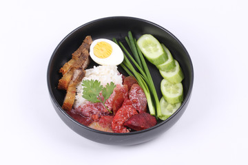 Jasmine rice with meat and boiled egg topped red sweet sauce .