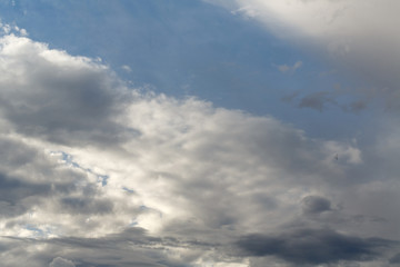 Fototapeta na wymiar Cumulus clouds against a blue sky. Overcast. Weather forecast.