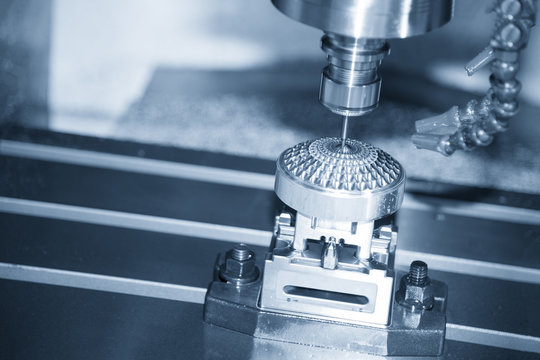 The Hi-precision  CNC milling machine with cutting sample in blue-silver tone incline scene.