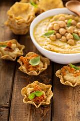 Homemade hummus in tortilla bowls