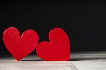 Fototapeta premium two hearts on dark wooden background