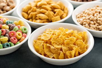 Variety of cold cereals in white bowls