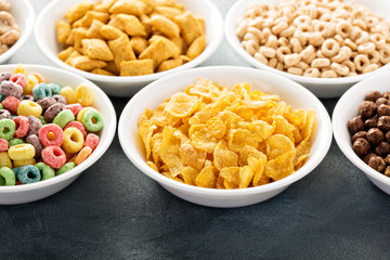 Variety of cold cereals in white bowls