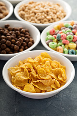 Variety of cold cereals in white bowls