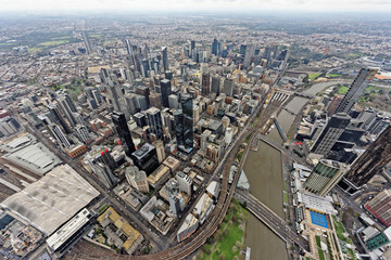 Aerial view over Melbourne CBD under overcast skies