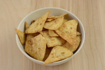 Pumpkin spice flavored crispbread snack in white bowl