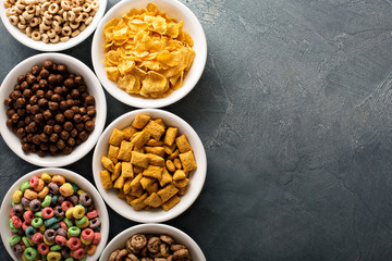 Variety of cold cereals in white bowls