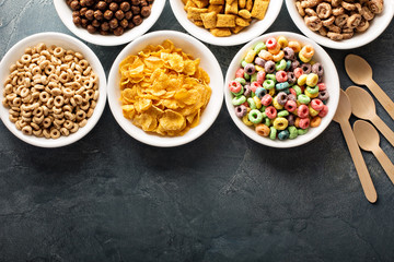 Variety of cold cereals in white bowls