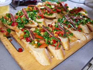Typical Italian Bruschetta with tomatoes, herbs and oil on toast