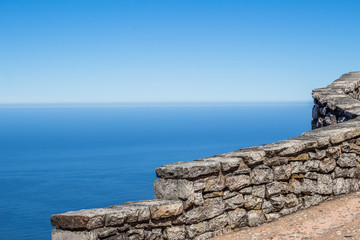 Stone wall high up on Table Mountain overlooking vast Atlantic Ocean