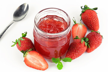 fresh strawberry jam in glass bottle with mint leaf