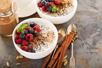 Quinoa porridge with raspberry and blueberry - obrazy, fototapety, plakaty