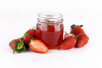fresh strawberry jam in glass bottle with mint leaf