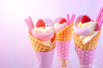 Valentine pink candy ice creams in cones.