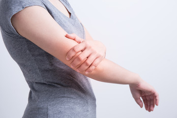 Asian woman with elbow pain.