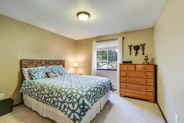Restful bedroom boasts a wicker headboard