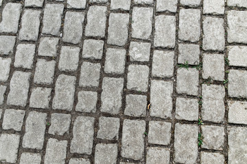 Abstract street background - gray paving slabs in the form of squares outdoors