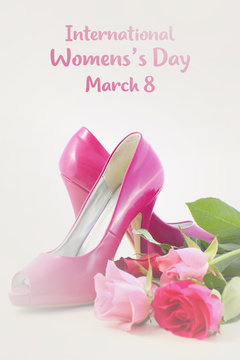 Pink high heel shoes with roses.