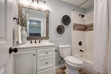 Lovely white bathroom design with reclaimed wood touches