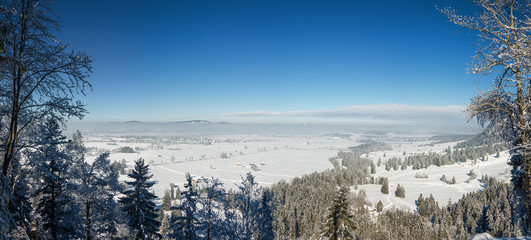 Sunny panoramic view of the plain of Fussen from Neuschwanstein castle, Bavaria, Germany.