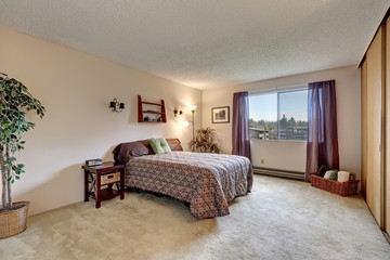 Traditional bedroom with warm beige walls paint color