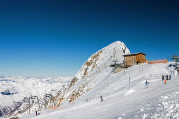 Sunny view of Austrian Alps from viewpoint of ski resort Zillertal Hintertuxer Glacier, Tirol, Austria.