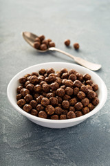 Chocolate cereals in a white bowl