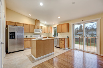 Light open concept kitchen room with vaulted ceiling