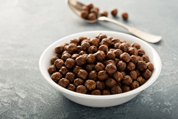 Chocolate cereals in a white bowl