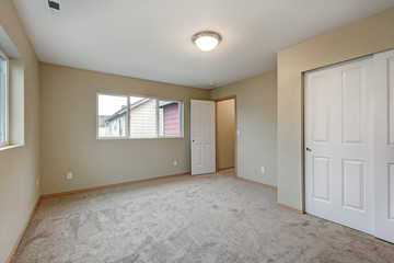 Empty beige bedroom interior of new contemporary home