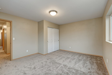 Empty beige bedroom interior of new contemporary home