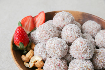Homemade strawberry, date, cashew and coconut bliss ball