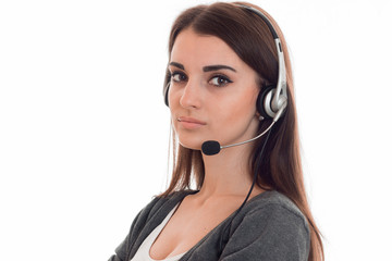 close up of young serious call center woman woman with headphones and microphone isolated on white background