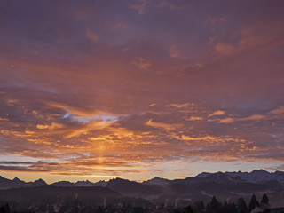 Burning sky over swiss mountains