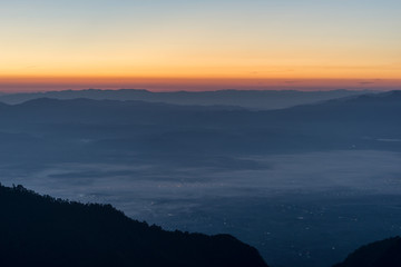 Fototapeta premium Foggy mountains in a winter morning
