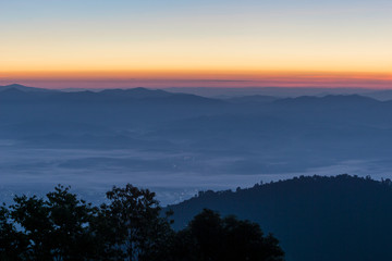 Foggy mountains in a winter morning